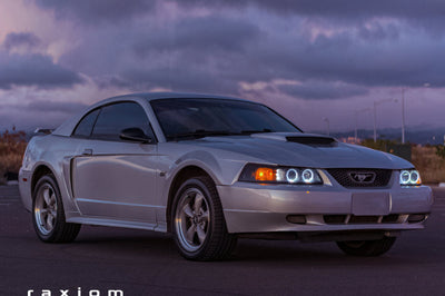 Raxiom 99-04 Ford Mustang Dual LED Halo Projector Headlights- Black Housing (Smoked Lens) - Lights