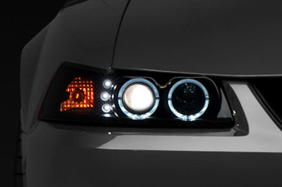 Raxiom 99-04 Ford Mustang Dual LED Halo Projector Headlights- Black Housing (Smoked Lens) - Lights