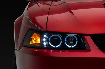 Raxiom 99-04 Ford Mustang Dual LED Halo Projector Headlights- Black Housing (Clear Lens) - Lights