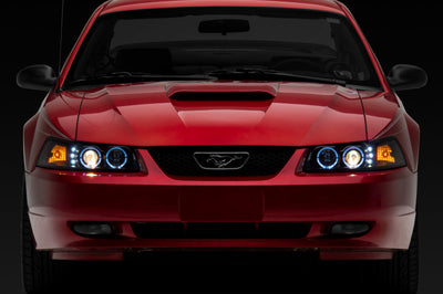 Raxiom 99-04 Ford Mustang Dual LED Halo Projector Headlights- Black Housing (Clear Lens) - Lights