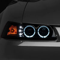 Raxiom 99-04 Ford Mustang Dual LED Halo Projector Headlights- Black Housing (Smoked Lens) - Lights