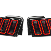 Raxiom 99-04 Ford Mustang Excluding 99-01 Cobra Icon LED Tail Lights- Black Housing (Smoked Lens) - Lights