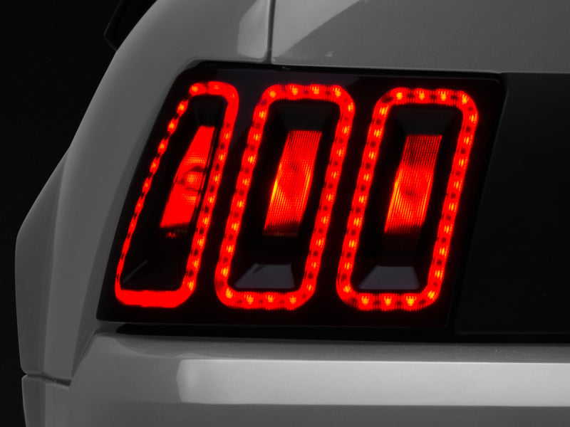Raxiom 99-04 Ford Mustang Excluding 99-01 Cobra Icon LED Tail Lights- Black Housing (Smoked Lens) - Lights