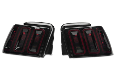Raxiom 99-04 Ford Mustang Excluding 99-01 Cobra Icon LED Tail Lights- Black Housing (Smoked Lens) - Lights