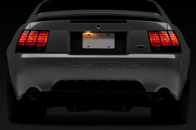 Raxiom 99-04 Ford Mustang Excluding 99-01 Cobra Tail Lights- Black Housing (Smoked Lens) - Lights