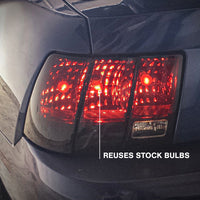 Raxiom 99-04 Ford Mustang Excluding 99-01 Cobra Tail Lights- Black Housing (Smoked Lens) - Lights