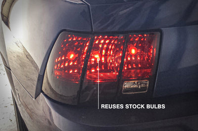 Raxiom 99-04 Ford Mustang Excluding 99-01 Cobra Tail Lights- Black Housing (Smoked Lens) - Lights
