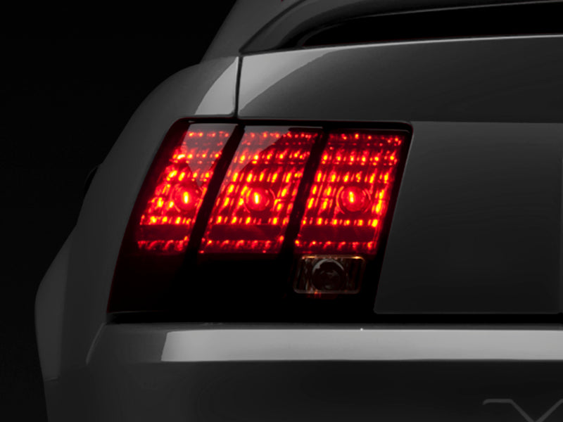 Raxiom 99-04 Ford Mustang Excluding 99-01 Cobra Tail Lights- Black Housing (Smoked Lens) - Lights