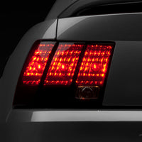 Raxiom 99-04 Ford Mustang Excluding 99-01 Cobra Tail Lights- Black Housing (Smoked Lens) - Lights
