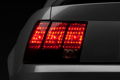 Raxiom 99-04 Ford Mustang Excluding 99-01 Cobra Tail Lights- Black Housing (Smoked Lens) - Lights