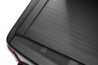 Roll-N-Lock 15-17 Ford F-150 65-5/8in E-Series Retractable Tonneau Cover - Covers